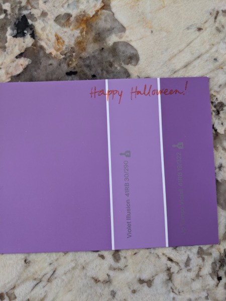 Melted Crayon as Halloween Favors - Happy Halloween written on a paint sample card