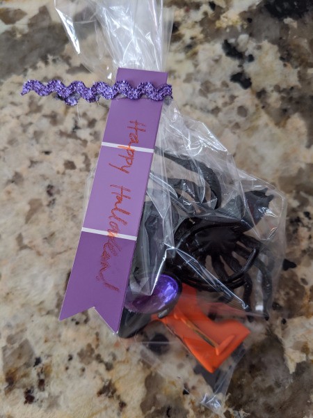 Melted Crayon as Halloween Favors - tag attached to sticker ribbon and bag