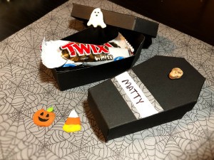 Paper Coffin Treat Boxes - open coffin with candy and other Halloween decorations