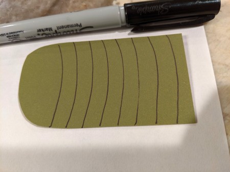 Dragon Pumpkin Decoration - body piece with horizontal lines drawn with a Sharpie