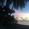 A tropical sunset on a beach in Tahiti.