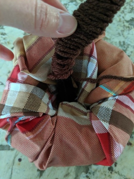 Fabric Covered Foam Pumpkin - place the yarn covered stem in the pumpkin