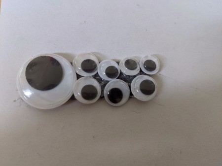 A googly eye covered strip of felt.