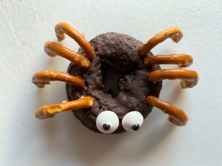 Halloween Spider Donuts - attach eyes with icing