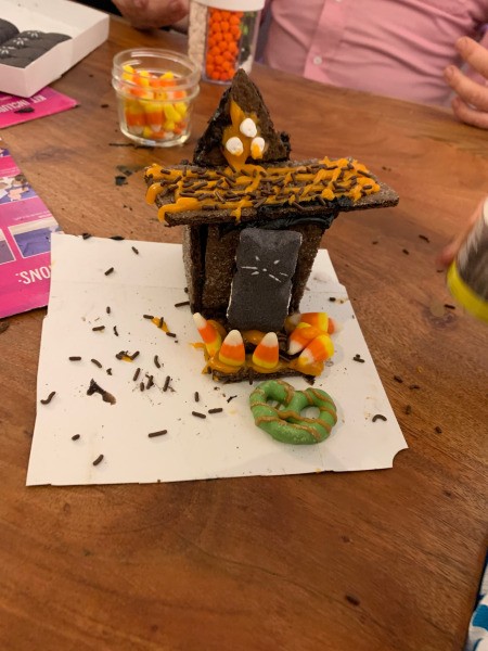 Haunted Gingerbread House - decorated graham cracker house on a piece of white paper