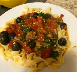 Greek Lamb Over Noodles on plate