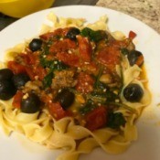 Greek Lamb Over Noodles on plate