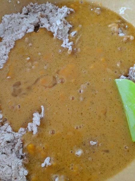 adding wet ingredients to apples & dry ingredients