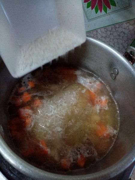 adding rice to pot