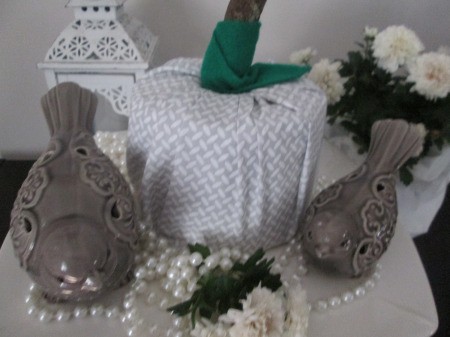 No Sew No Glue Fabric Pumpkin - closeup of a gray and white fabric pumpkin in and arrangement with flowers, ceramic birds, and a string of pearls