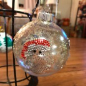 Decorated Clear and White Ornaments - clear ornament with a Santa sticker