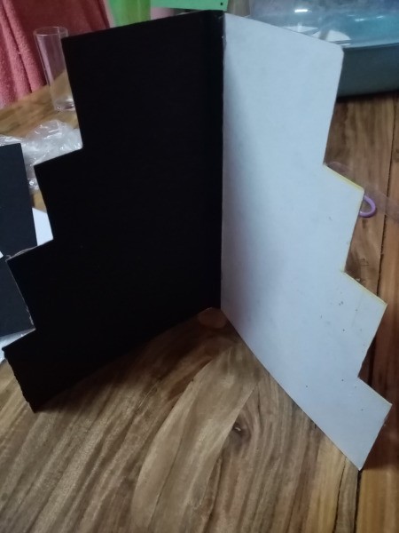 DIY 4 Tier Cupcake Stand - attach the two pieces at the folds, black and white alternating