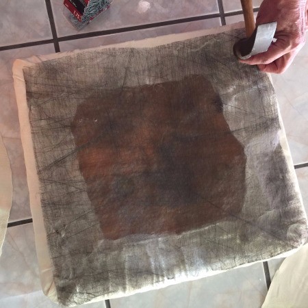 Tablecloth for Reupholstering a Chair - replacing the thin fabric covering the brads
