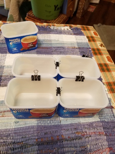 A caddy made from recycled Maxwell House coffee containers.