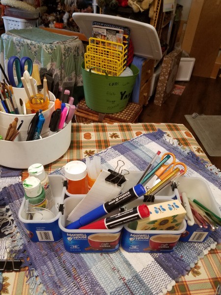 A caddy made from recycled Maxwell House coffee containers.