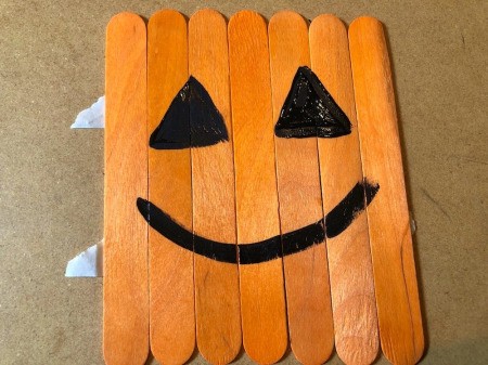 Halloween Craft Stick Puzzles - paint two black triangles for eyes and a smile
