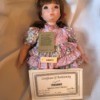 Value of a Seymour Mann Porcelain Doll - doll with certificate, name tag, and tag with info about the artist