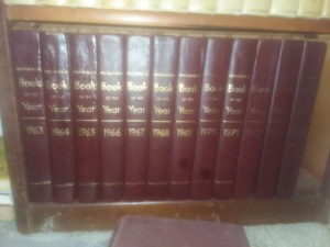 Value of Encyclopedia Britannica and Wagnalls Dictionary - books of the year on a shelf