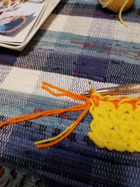 Candy Corn Hot Pad - on 6th row crochet with orange added to the yellow and then continue with two strands of orange