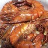 cooked unpeeled Garlic Butter Shrimp on plate