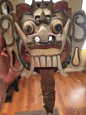Wooden Mask Identification - painted wooden mask with large teeth and tusks