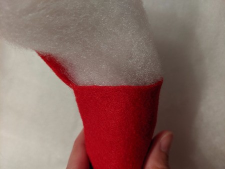 Toddler Girl's Dragon Halloween Costume - closeup of stuffing the tail