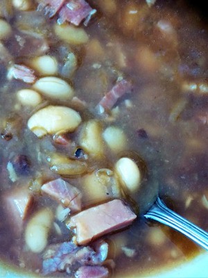 A closeup of ham and bean soup.