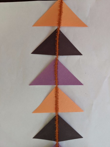Hanging Halloween Themed Hoop Decoration - five Halloween colored triangles attached to the ribbon