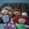 Selling Cabbage Patch Dolls - 4 dolls on a couch