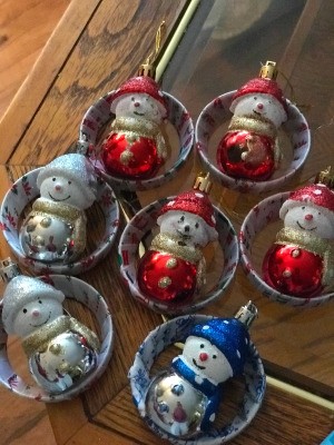 Handcrafted Christmas Ornaments - several ornaments lying on a table