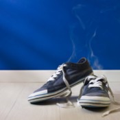 Blue canvas tennis shoes steaming.