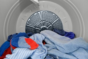 Blue clothes in a dryer