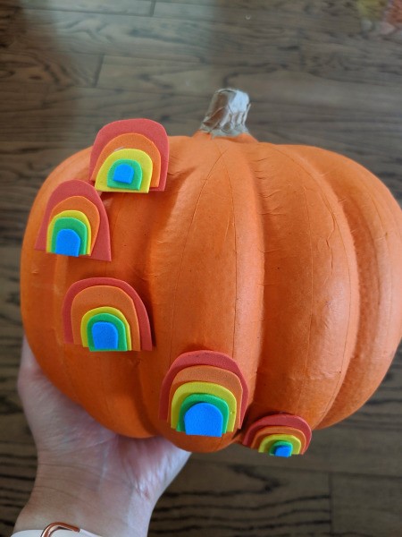 Mini Rainbows Decorated Pumpkin - rainbows arranged and glued to a foam pumpkin