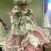 Identifying a Porcelain Doll - doll in fancy pink dress overlain with a  lace layer and a floral overskirt