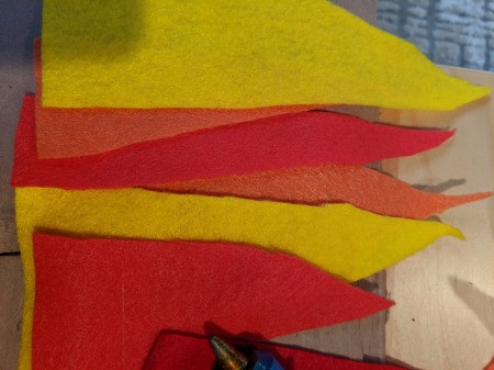 Blowing Fire Costume Accessory - cut triangle shaped flames from red, orange, and yellow felt
