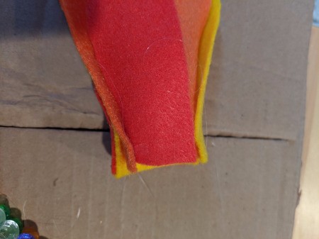 Blowing Fire Costume Accessory - cut and glue enough flames to go around the inside of the tube