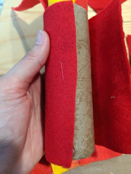 Blowing Fire Costume Accessory - glue the red felt pieces around the outside of the tubes