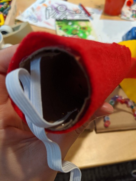 Blowing Fire Costume Accessory - glue a piece of elastic cut to size to the opposite end of the tube and it is ready