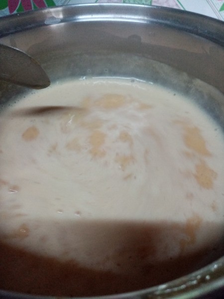 stirring custard in pan