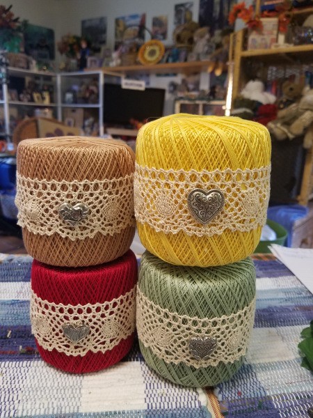 Crochet Thread Spool Pumpkins - heart buttons attached to the lace