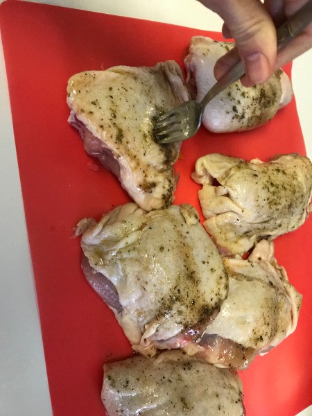 forking chicken pieces