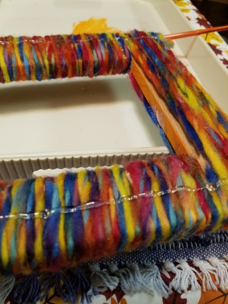 Yarn Wrapped Frame - adding a long bead of glue all the way around the back of the frame on the wrapped yarn