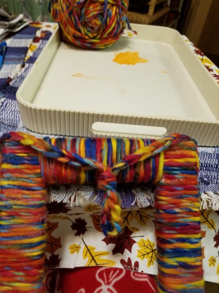 Yarn Wrapped Frame - knot tied in the chain to shorten