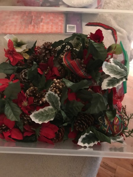 Poinsettia Wreath - plastic box with flowers, leaves, and pine cones