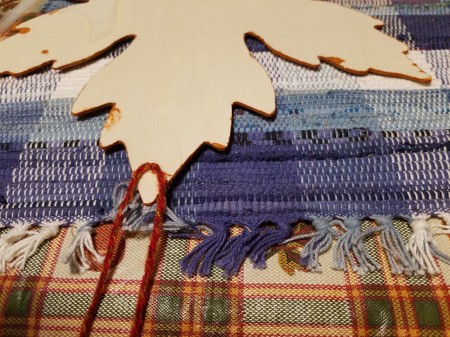 Yarn Embellished Wooden Maple Leaf - once dry make the hanger be part of the wrap, the leaf has a hole at the top