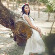 A bride wearing a floral crown.