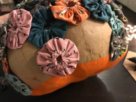 Yo Yo Covered Papier-mâché Pumpkins - continue until the pumpkin is completely covered with yo yos