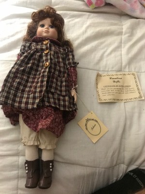 Value of a Doll from the Emerald Doll Collection - doll lying on a bed