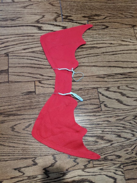 Boy's Dragon Halloween Costume - wings with straps lying on the floor