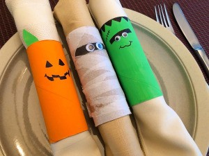 Cardboard Halloween Napkin Rings - completed napkin rings lying across a plate